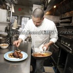 Chef Carlos Olivares prepares his New Orleans roasted duck with cranberry and orange glaze, baby Yukon gold potatoes, Julienne zucchini and carrots, at The Big Easy Bistro at 40 Front Street in the City of Newburgh, NY on Friday, March 5, 2010.  Times Her