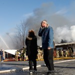 Ron Palmer reacts at the scene of a three-alarm fire at Algonquin Plaza, 190 South Plank Road in the Town of Newburgh, NY on Friday, January 6, 2012. His business, Monell's Camera Shop was severely damaged by the fire.  CHET GORDON/Times Herald-Record